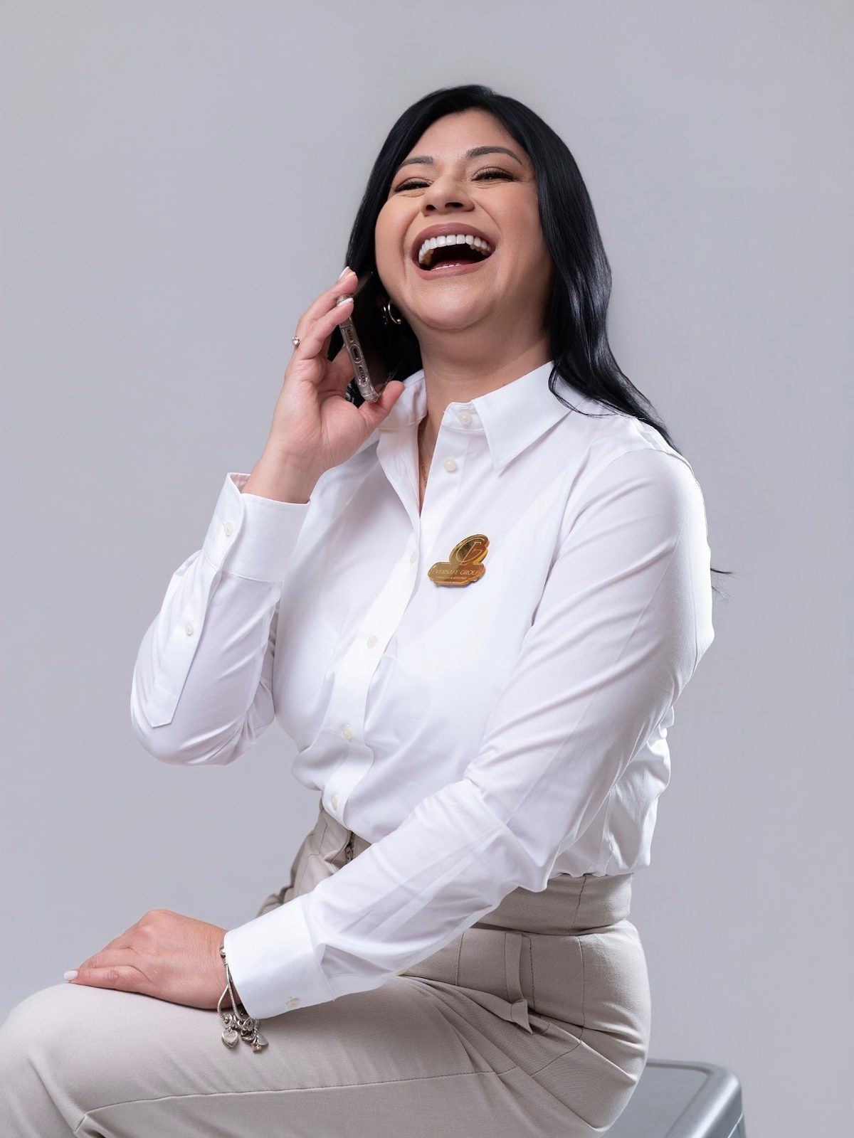 Personal brand portrait laughing on a phone