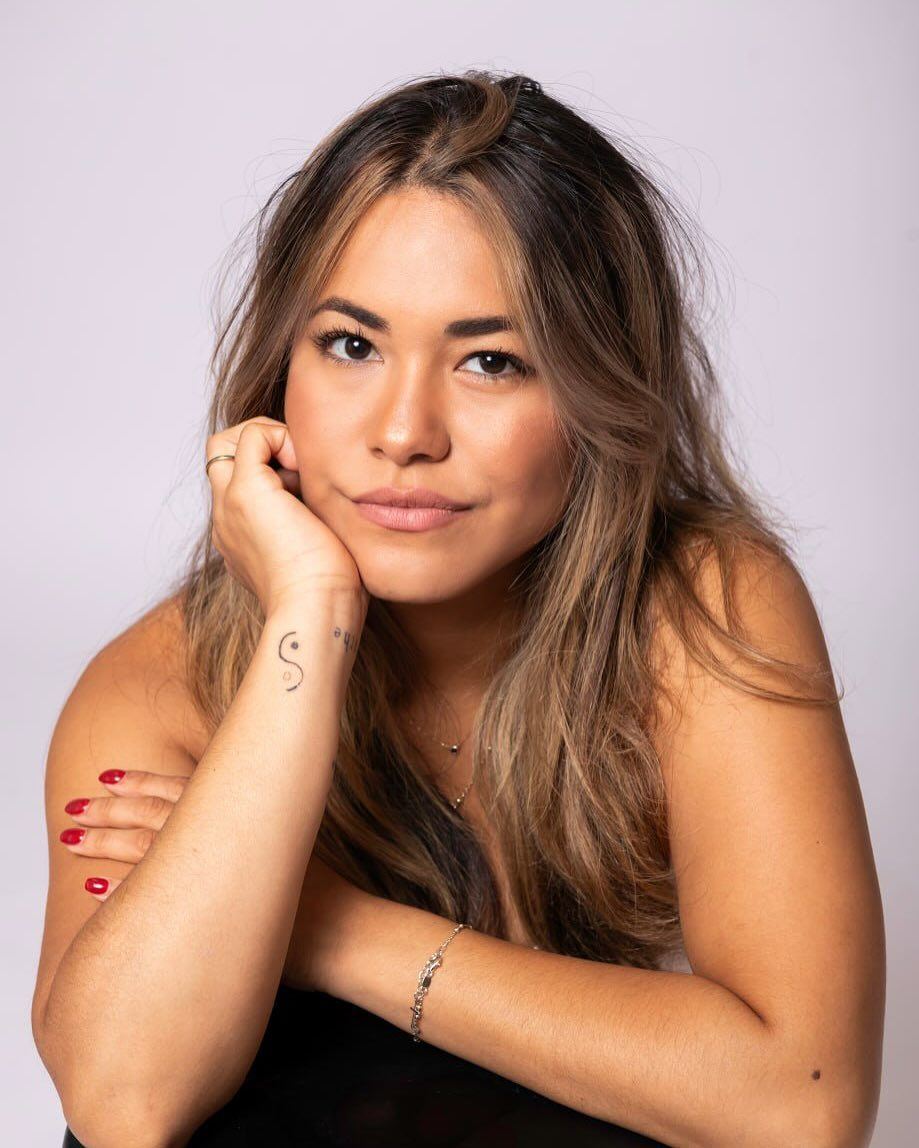 Close headshot with chin resting on hand