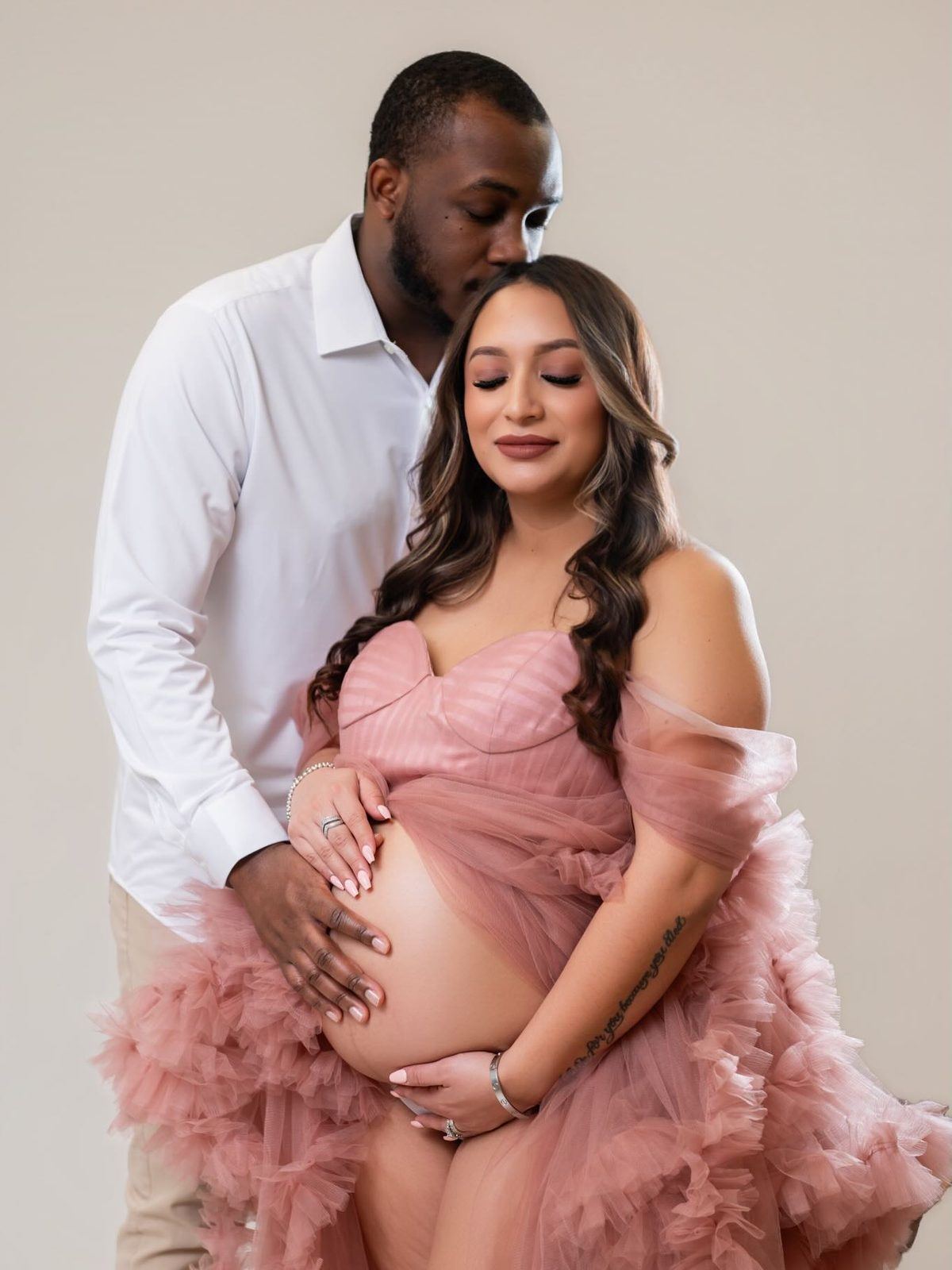 Couple maternity portrait in blush tulle